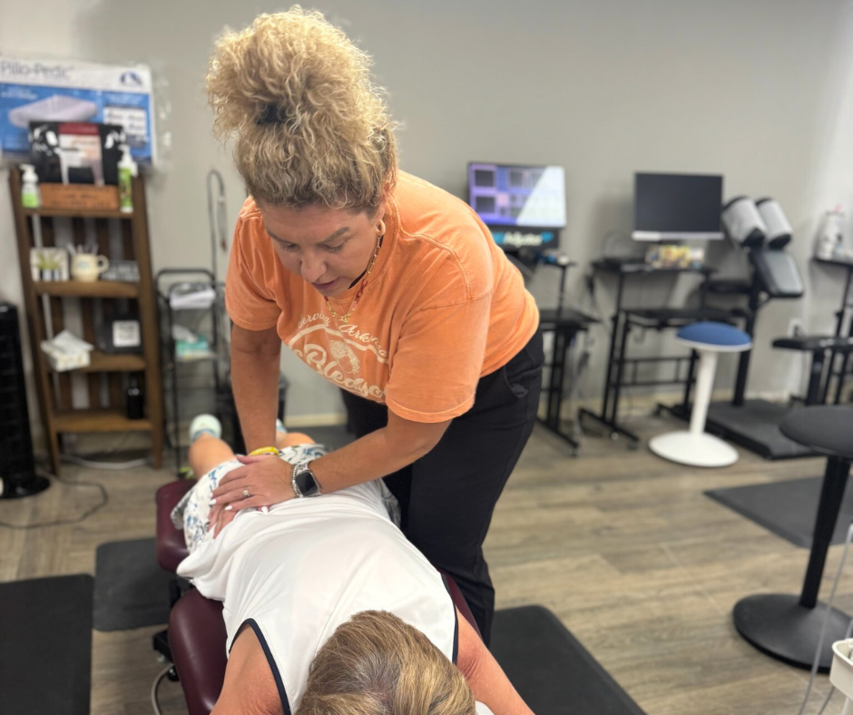 Dr. Bledsoe adjusting a patient.