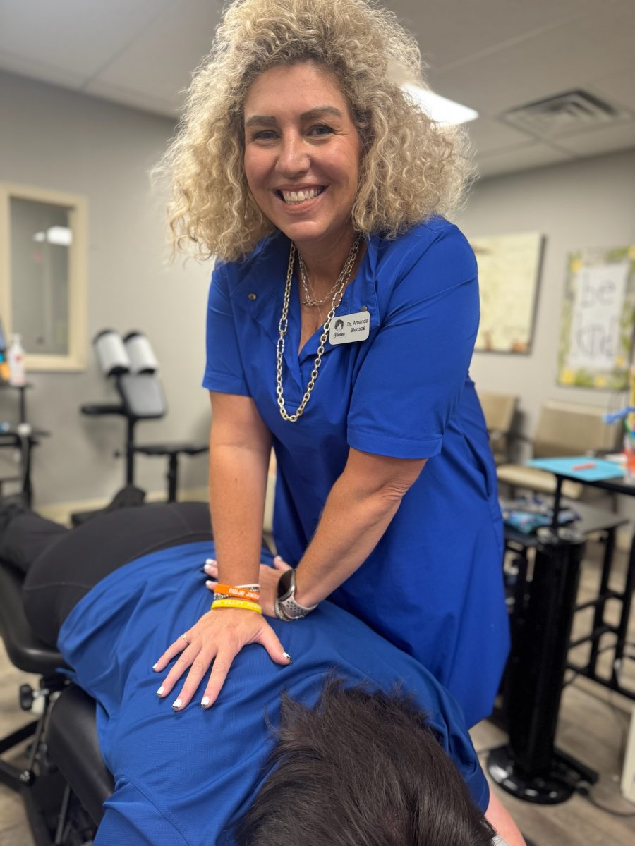 Dr. Bledsoe adjusting a patient.